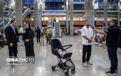 عکس/ قهرمان کشتی آزاد جهان در کنار فرزندش